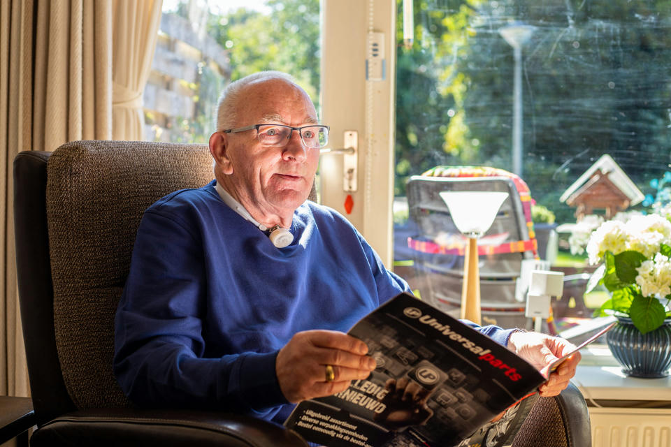 atos-medical-tracheostomy-man-reading